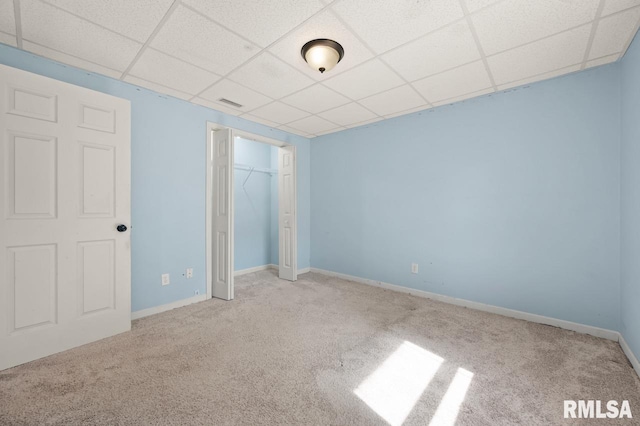 25633 N County Road 2500 E, Manito, IL 61546 - unfurnished bedroom with carpet floors, a paneled ceiling, a closet, and baseboards