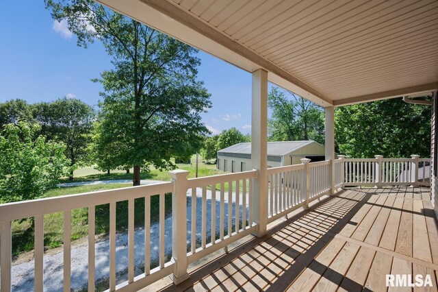 25633 N County Road 2500 E, Manito, IL 61546 - deck featuring an outbuilding and view of wooded area