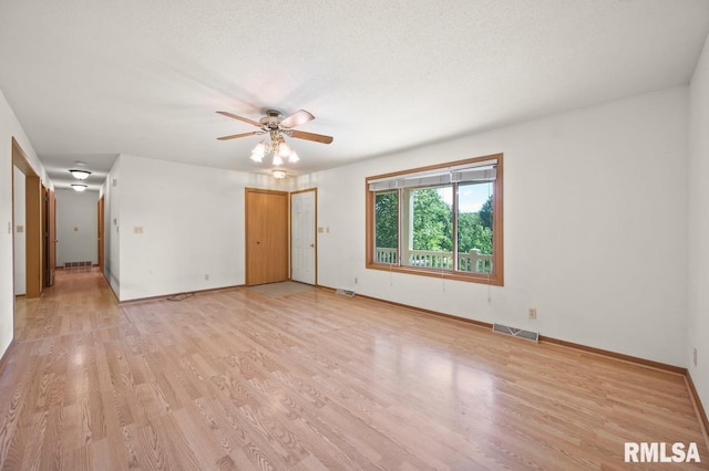 25633 N County Road 2500 E, Manito, IL 61546 - spare room featuring ceiling fan, light wood finished floors, and baseboards
