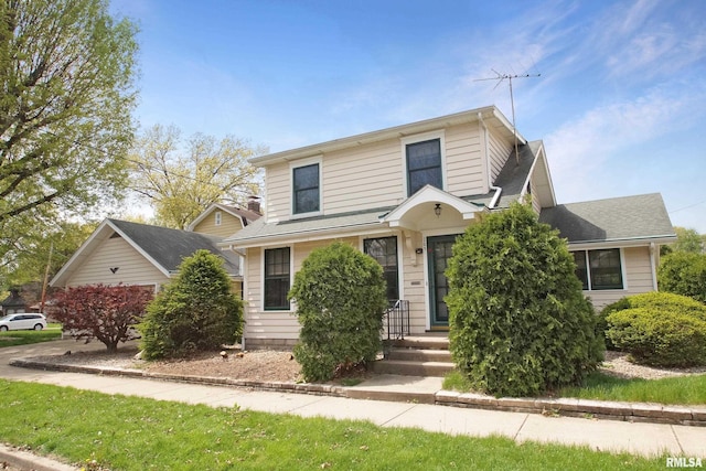 traditional-style home with a shingled roof