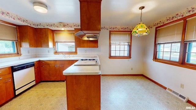 kitchen featuring white dishwasher, plenty of natural light, light floors, visible vents, and stovetop