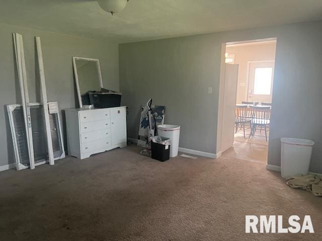 carpeted bedroom featuring baseboards