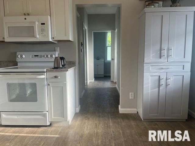 kitchen with light countertops, dark wood-style flooring, white appliances, and white cabinetry
