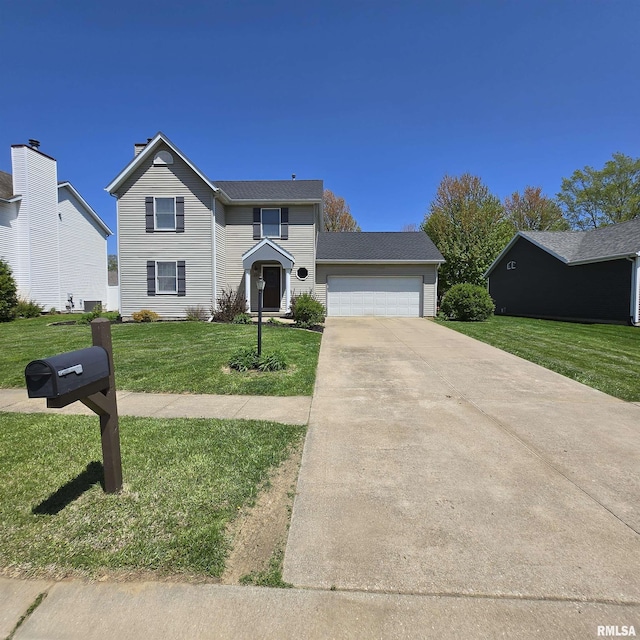 traditional-style house featuring an attached garage, driveway, and a front yard