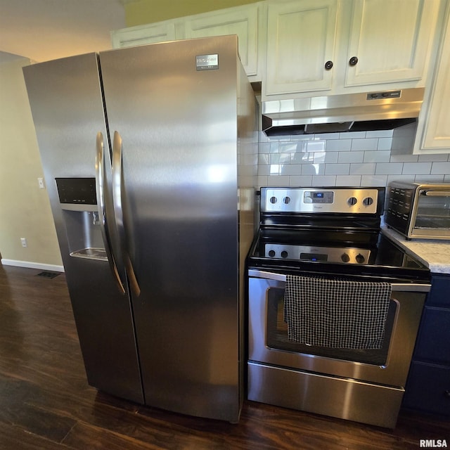 kitchen featuring a toaster, dark wood-type flooring, white cabinetry, under cabinet range hood, and stainless steel appliances