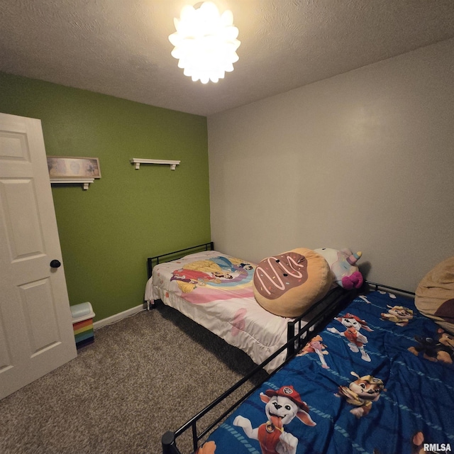 bedroom featuring baseboards and carpet
