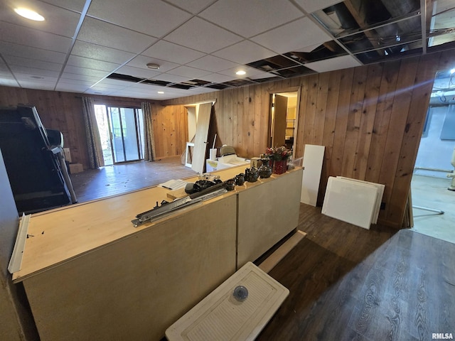 living room featuring wood finished floors and wooden walls