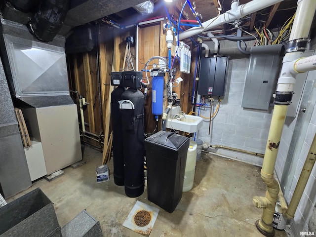 utilities with heating unit, water heater, and electric panel