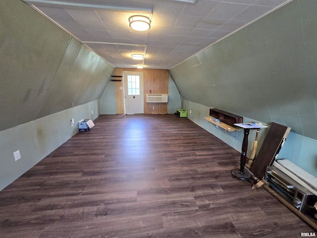 bonus room featuring lofted ceiling and wood finished floors
