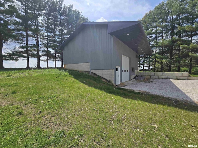view of side of property with a lawn