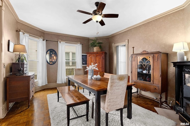 1122 N Broad St, Galesburg, IL 61401 - dining room with crown molding, a ceiling fan, and baseboards