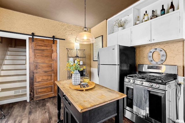 1122 N Broad St, Galesburg, IL 61401 - kitchen featuring wood counters, a textured wall, white cabinetry, and stainless steel appliances