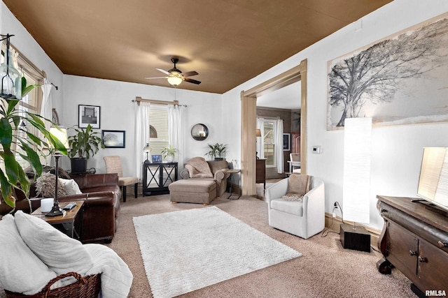 1122 N Broad St, Galesburg, IL 61401 - living room with carpet floors, ceiling fan, and a wealth of natural light