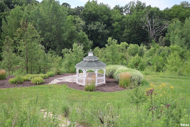 5727 W Woodbriar Ln, Peoria, IL 61615 - view of green lawn featuring a gazebo and a forest view