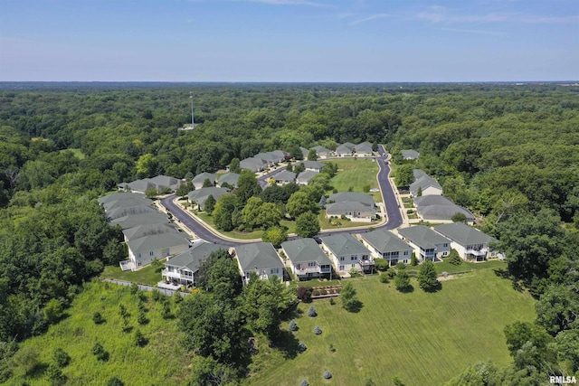 5727 W Woodbriar Ln, Peoria, IL 61615 - aerial view of property and surrounding area with a heavily wooded area and nearby suburban area