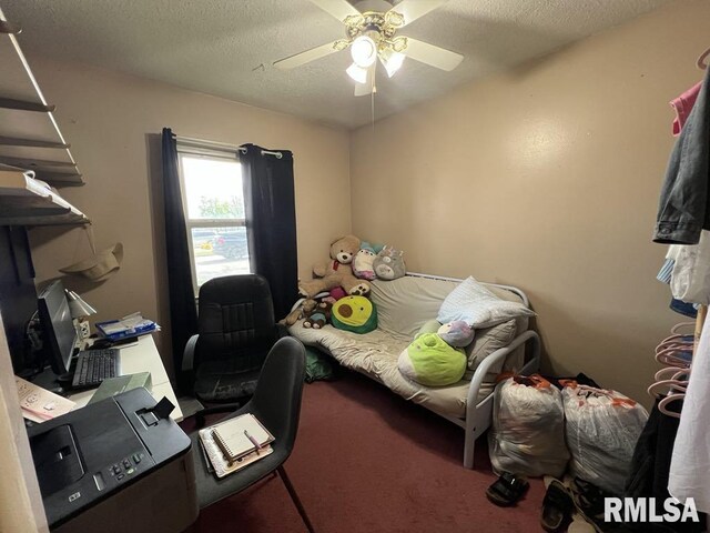 1520 E Wheeler St, Macomb, IL 61455 - carpeted bedroom featuring a ceiling fan and a textured ceiling
