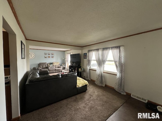 1520 E Wheeler St, Macomb, IL 61455 - living area with visible vents, ornamental molding, a textured ceiling, and baseboards