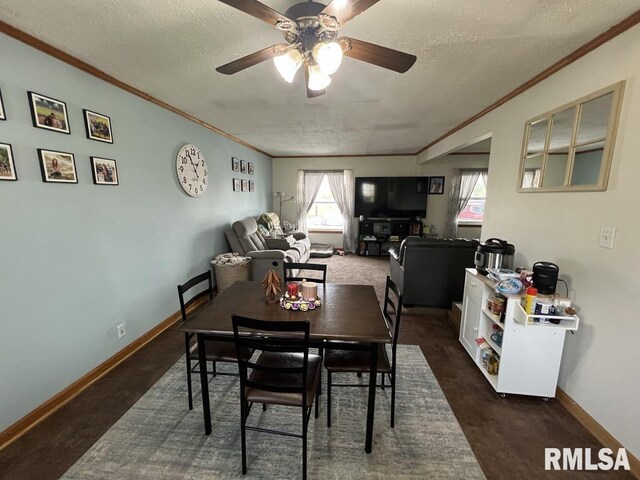 1520 E Wheeler St, Macomb, IL 61455 - dining space featuring baseboards, ornamental molding, a textured ceiling, and a ceiling fan