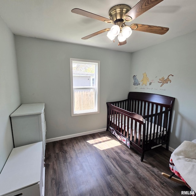bedroom with baseboards, ceiling fan, and wood finished floors