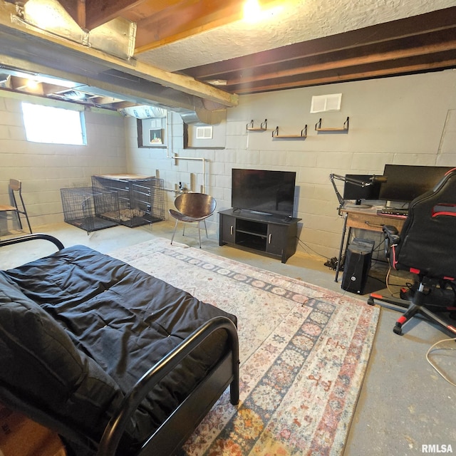 bedroom with concrete floors and visible vents