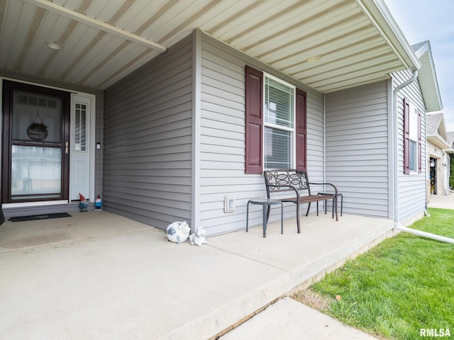 doorway to property with a porch