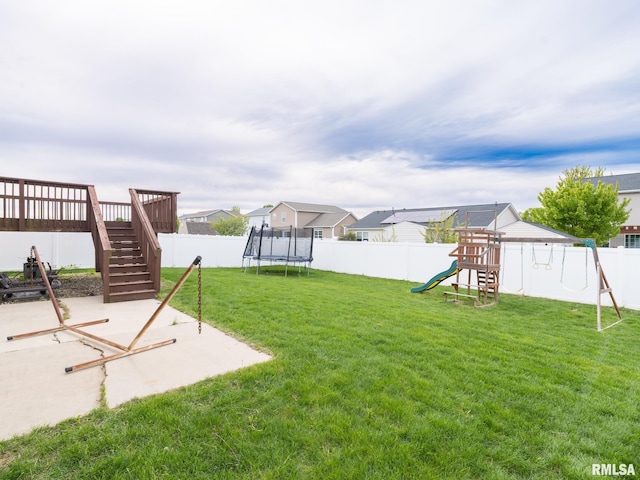 view of yard with a patio, a playground, a trampoline, stairway, and a fenced backyard