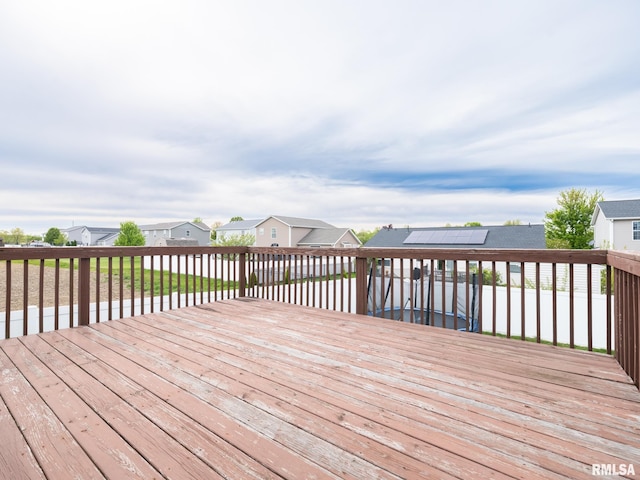 wooden deck with a residential view