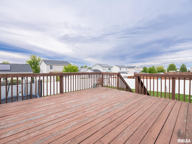 wooden terrace with a residential view