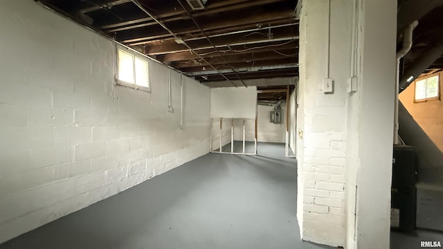 below grade area featuring concrete block wall