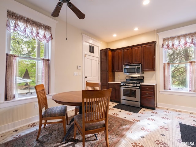 kitchen with baseboards, recessed lighting, light countertops, a ceiling fan, and appliances with stainless steel finishes