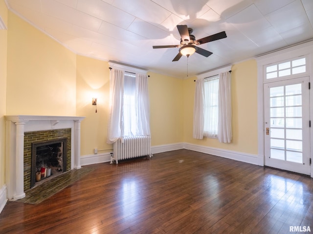 unfurnished living room with ornamental molding, radiator, ceiling fan, and hardwood / wood-style floors
