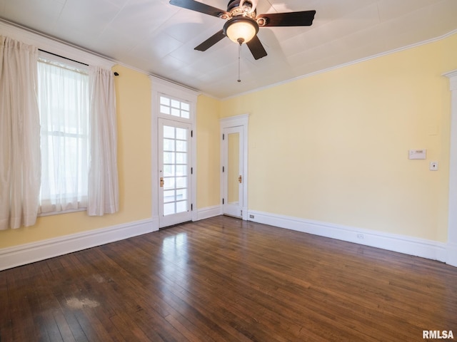 unfurnished room featuring crown molding, a ceiling fan, baseboards, and hardwood / wood-style flooring