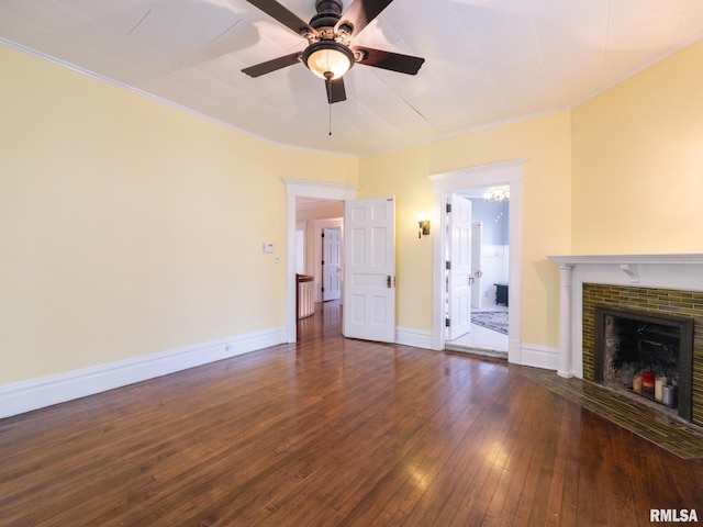 unfurnished living room with wood-type flooring, crown molding, baseboards, and ceiling fan