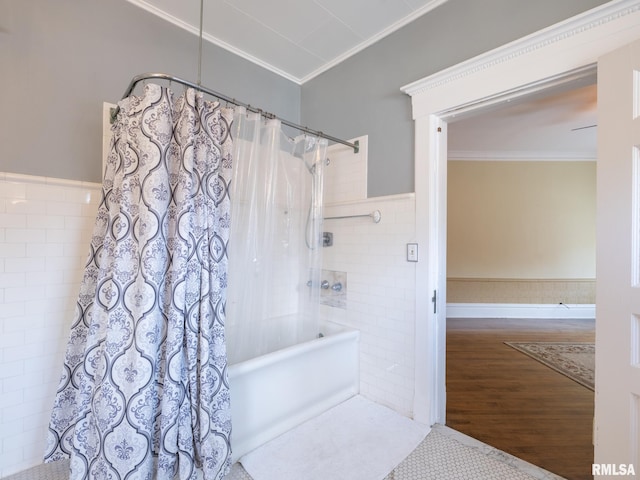 full bathroom featuring crown molding, tile walls, shower / bathtub combination with curtain, and wood finished floors