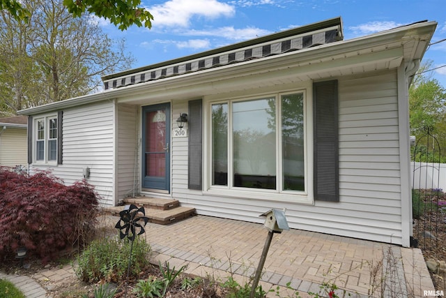 bungalow-style home with a patio