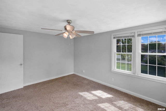 unfurnished room with carpet floors, ceiling fan, and baseboards