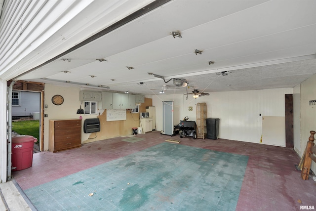 misc room with a garage
