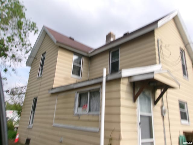 605 S 2nd St, Pekin, IL 61554 - view of side of property featuring a chimney