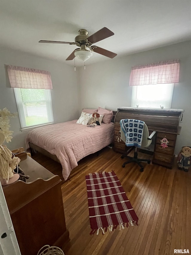 bedroom featuring ceiling fan and hardwood / wood-style flooring