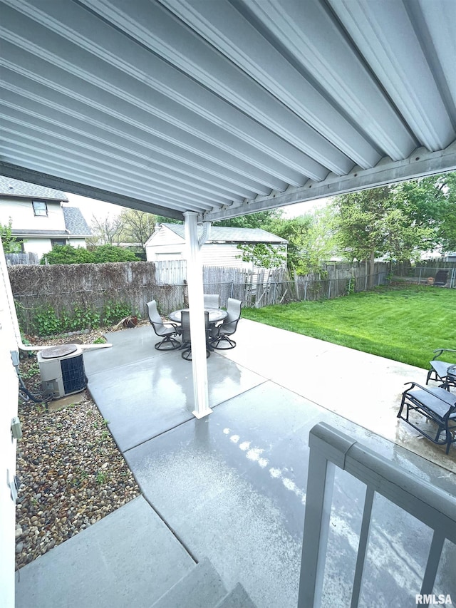 view of patio / terrace with central air condition unit and a fenced backyard