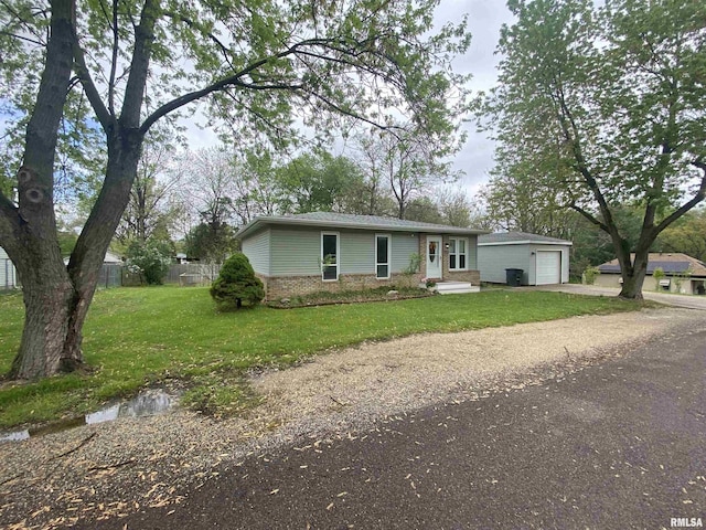203 E Whipp Ave, Bartonville, IL 61607 - view of front of home with driveway, a front yard, a detached garage, brick siding, and fence