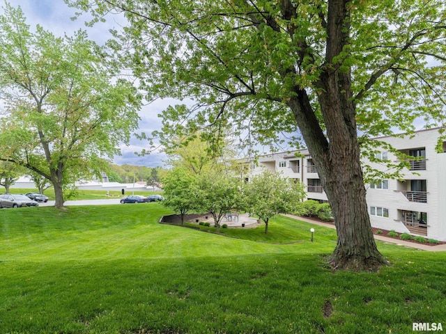 surrounding community featuring a lawn