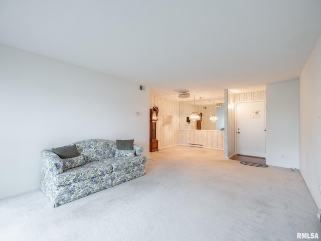 carpeted living area featuring a baseboard radiator and visible vents