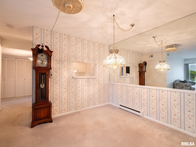 unfurnished dining area with visible vents, carpet, and baseboard heating