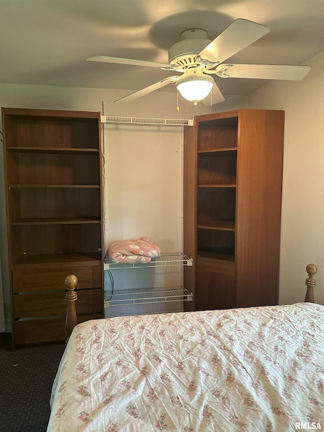 carpeted bedroom with a ceiling fan