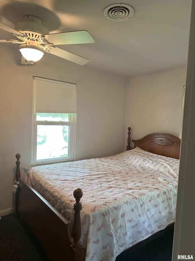 bedroom featuring visible vents, baseboards, and ceiling fan