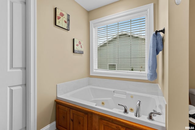 full bath with a tub with jets