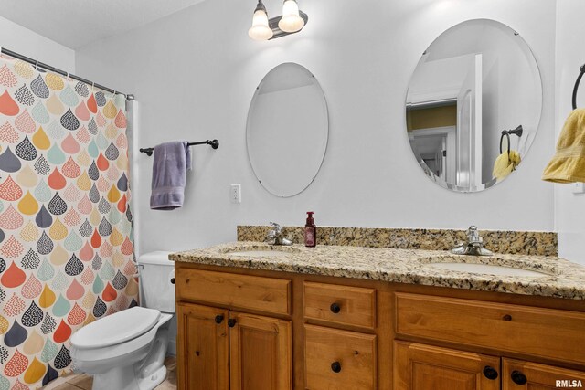 full bath featuring double vanity, toilet, a shower with curtain, and a sink