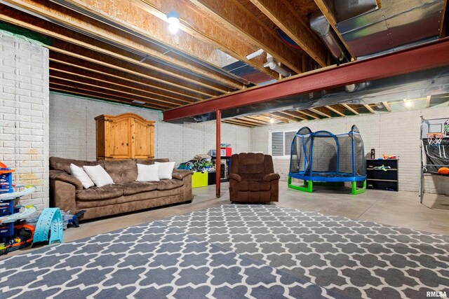 unfinished below grade area with brick wall