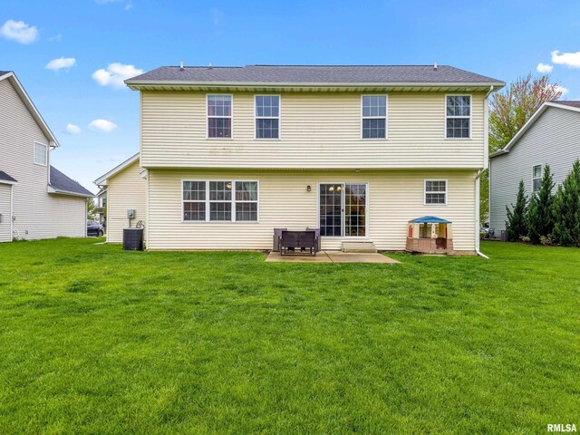 back of property with a yard, a patio, and cooling unit